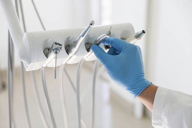 Professional Tooth Extraction technician working in Mathews, LA
